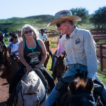 a group of people riding on the back of a horse