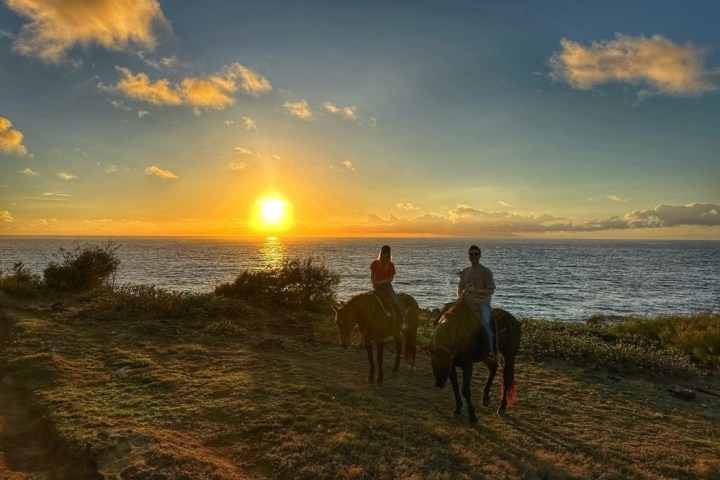 a sunset over a body of water