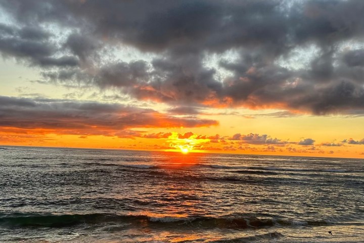 a sunset over a beach
