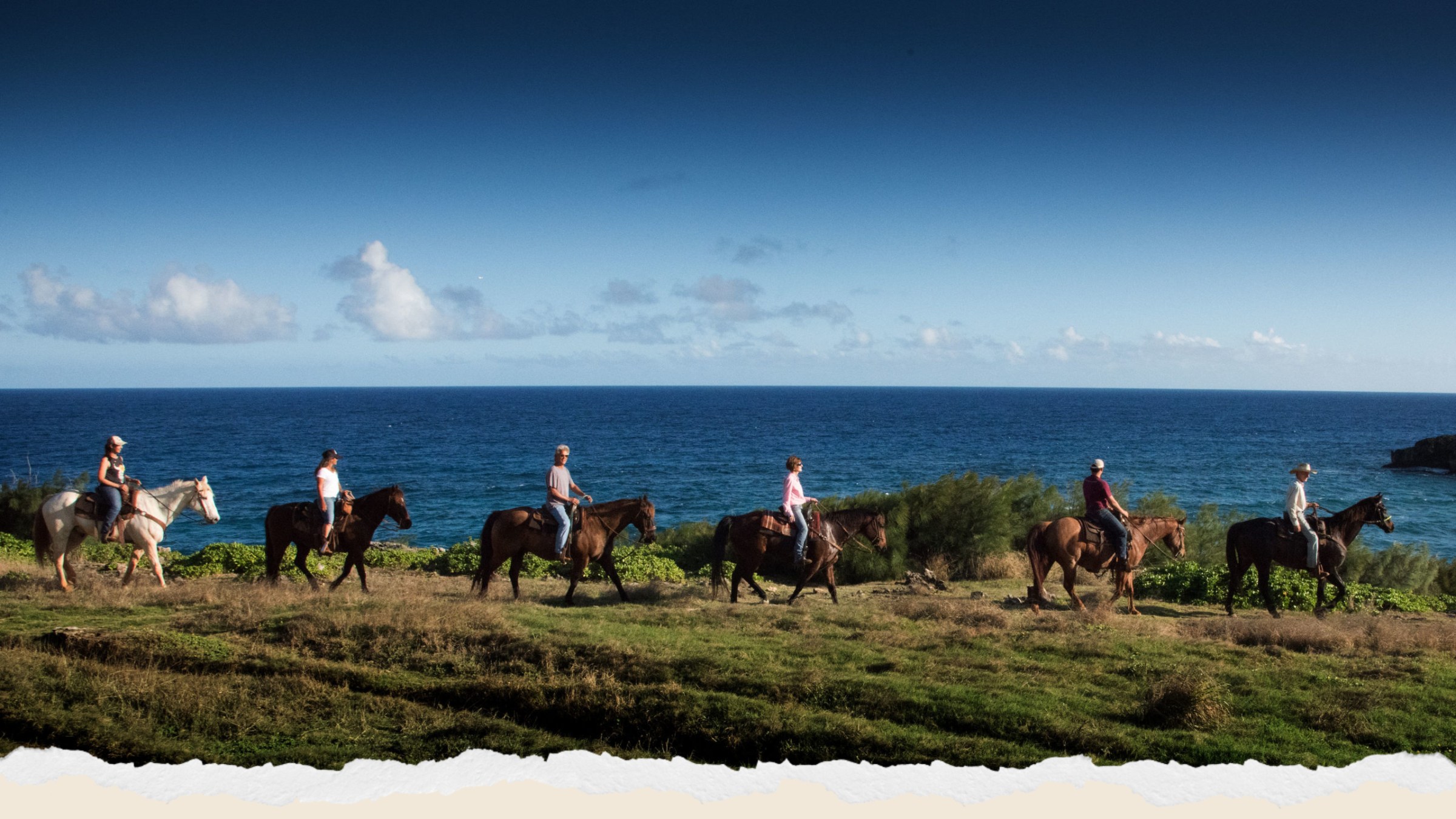 a group of people standing next to a body of water