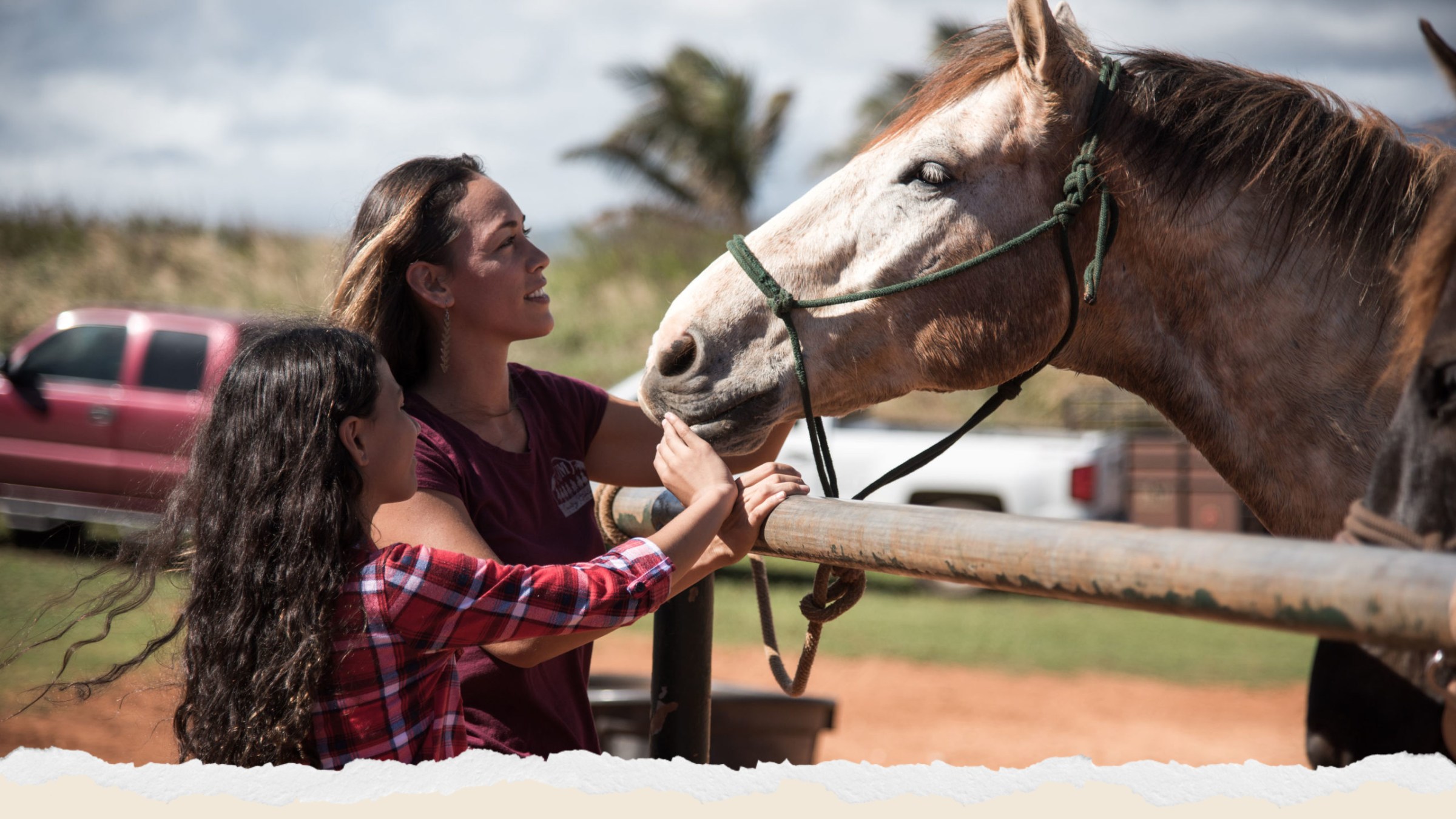 a woman standing next to a horse