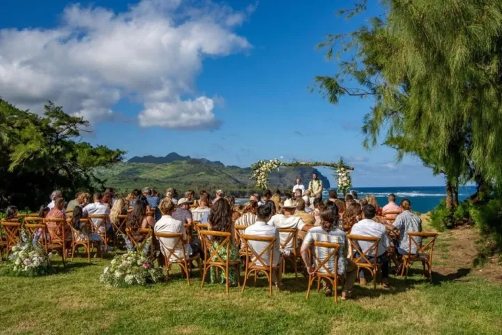 a group of people sitting at a picnic table