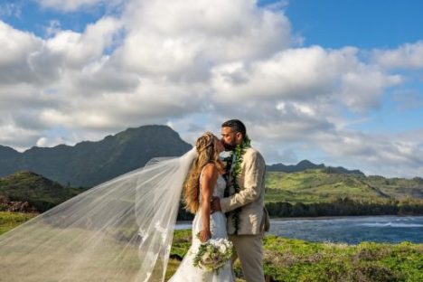 a man standing in front of a mountain